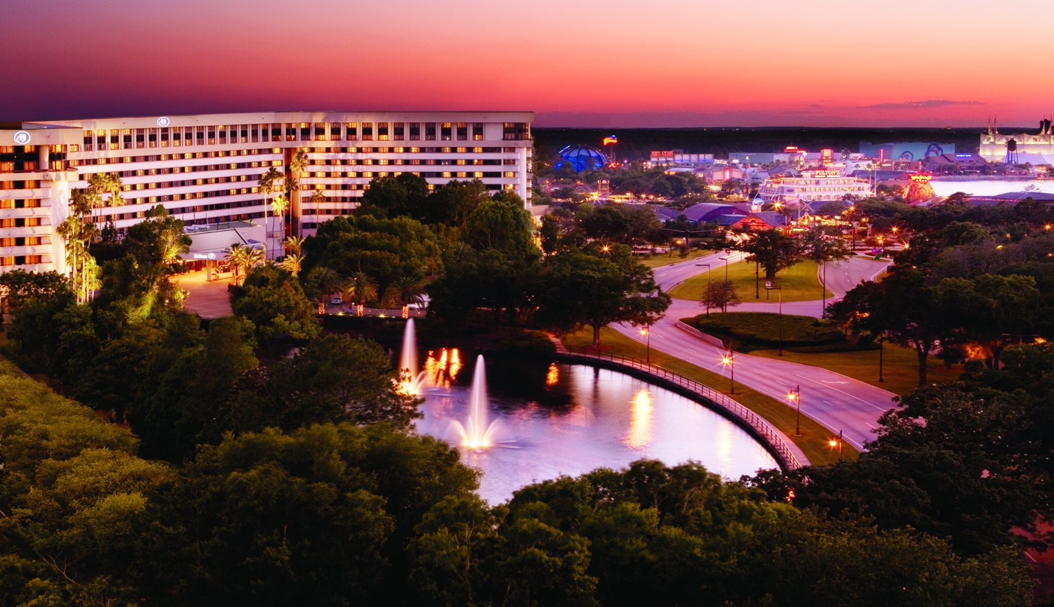 Hilton Orlando Lake Buena Vista at dusk, Disney Springs in the background